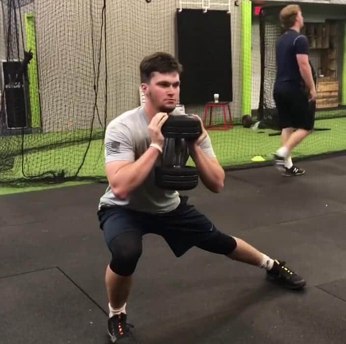 man performing goblet lateral lunge